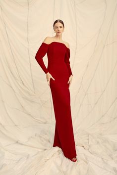 Circe is a stunning sleek floor length gown, cut from a high quality Italian stretch cloqué in a vibrant rich ruby red. The Circe Gown has a statuesque silhouette, with a beautiful stretch that sculpts and defines the body, and a stretch silk satin lining that makes this dress a dream to wear. The bodice is boned and has a layer of power mesh to sculpt, hold, and lift the body. A beautifully sculpted neckline frames the décolletage, and slim bracelet length sleeves are finished with a sculptural Suzannah London, Gown Suit, Column Skirt, Boutique Couture, Red Gowns, Formal Outfits, Floor Length Gown, Dress Inspo, Black Tie Event