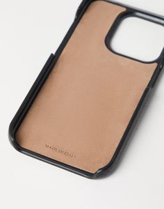 Grained calfskin cover for iPhone 15 Pro The excellence of Brunello Cucinelli materials enriches this iPhone 15 Pro case with a distinct touch. The accessory is detailed in grained calfskin in the season’s special delicate color, while the interior is lined with soft suede. Modern Black Leather Phone Accessories, Modern Leather Phone Accessories, Rectangular Shape, Modern Leather Rectangular Phone Accessories, Luxury Leather Phone Accessories, Tuxedo T Shirt, Boutique Online, Cover For Iphone, Leather Logo, Sneaker Heels