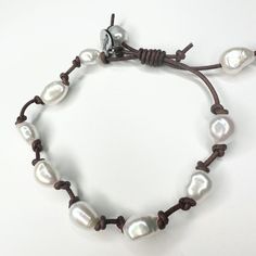 Knotted genuine leather with beautiful freshwater pearls. There is a sliding knot in the leather. So easy to slip over your hand and tighten to any size. Wear with anything beach or nautical, or with jeans and casual outfits. Shop with confidence! We want you to love wearing, sharing and giving Beauty In Stone Jewelry! We gladly accept returns within 15 days of purchase on unworn jewelry. Any problems after that we're happy to repair it or replace it within 60 days. Freshwater Pearl Bracelet, Leather Bracelets, Sliding Knot, Pearl Bracelet, Stone Jewelry, Fresh Water, Freshwater Pearls, Leather Bracelet, Nautical