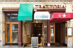 the front entrance to a restaurant with two stars on the awnings and a sign that says, tricolori