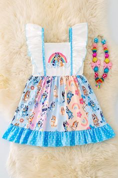 One dress  Top Ruffles  Colorful Pattern **Boutique clothing runs HALF-SIZES  XS-18/24m S-2/3T M-3/4T L-4/5 XL-5/6 2X-6/7 3X-7/8 Cute Blue Ruffled Dresses, Cute Blue Dresses With Ruffles, Cute Multicolor Dress With Ruffle Hem, Cute Multicolor Ruffled Dress, Cute Light Blue Dress With Ruffle Hem, Whimsical Blue Dress With Ruffles, Spring Cartoon Print Fun Dress, Playful Blue Dress For Playtime, Playful Blue Dresses For Playtime