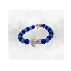 Dive into the serenity of the ocean with our Cobalt Blue Sea Turtle Charm Bracelet, designed for lovers of the sea and nature-inspired beauty. The vibrant 8mm cobalt blue beads shimmer as they catch the light, creating an eye-catching sparkle. At the heart of this bracelet is a delicate blue sea turtle charm, symbolizing longevity and tranquility, paired with a lustrous pearl turtle charm that adds a touch of elegance. Handcrafted with precision and care, this bracelet features an adjustable fit Blue Sea Turtle, Ocean Inspired Jewelry, Turtle Bracelet, Turtle Charm, A Turtle, Cats Eye, Blue Pearl, Blue Cats, Bracelet Clasps