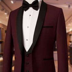 a red tuxedo with black lapel and white shirt on display in a store