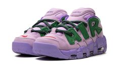 The AMBUSH x Women’s Nike Air More Uptempo Low “Lilac" is a collaboration by the popular luxury jewelry brand and Nike on a contemporary-looking version of the retro basketball sneaker.  The Air More Uptempo Low is the modified low-top version of the ‘90s basketball shoe that was most notably worn by Scottie Pippen with the Chicago Bulls in 1996.  AMBUSH’s take on the silhouette updates its design with a Lilac-colored nubuck construction and oversized, graffiti-inspired Apple Green “AIR” branding on the sides.  A University Red Swoosh is embroidered on the toe.  “AMBUSH” branding appears on the tongue and heel of the midsole.  Additional details include green laces, a pull tab on the heel, and a dark Lilac-colored rubber outsole.  Release date: October 6, 2023 90s Basketball Shoes, Nike X Ambush, Lilac Shoes, Nike Air More Uptempo, Nike Air More, Scottie Pippen, Retro Basketball, Luxury Jewelry Brands, Basketball Sneakers