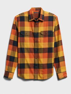 COTTON FLANNEL: Not too heavy, nor too light, our 100% cotton flannel is double-brushed for extra-soft, coziness.  UNTUCKED: Specially cut 1" shorter through the body for an untucked fit that still looks sharp.  Point collar.  Chest pockets.  Button front.  Shirttail hem.  Slim fit.  Long sleeves.  Untucked: Hits at the high hip.  Center back length (size M): Regular 28. 75", Tall 30. 25" Sleeve length: Regular 35", Tall 36. 5" Model: Size M, 6'2" (188cm). Orange Plaid, Boys Wear, Professional Attire, Cotton Flannel, Flannel Shirt, Women's Plaid Shirt, Banana Republic, Top Shirt, Slim Fit