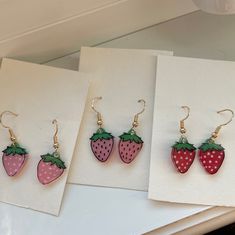 These earrings are just too sweet! What use to be pins are now for your ears! Made with shrinky dink plastic, painted with acrylics and hung on hypoallergenic earring hooks! Strawberries available in 4 different styles as well as earring hooks which are available in both gold and silver (if you want silver just make a note when you order<3) Cute Enamel Earrings, Cute Hand Painted Red Jewelry, Cute Resin Earrings, Cute Red Hand Painted Jewelry, Cute Handmade Enamel Earrings, Cute Hand Painted Resin Earrings, Cute Red Hand-painted Jewelry, Cute Hand Painted Drop Earrings, Cute Dangle Enamel Earrings