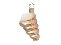 an ornament shaped like a shell hanging from a string