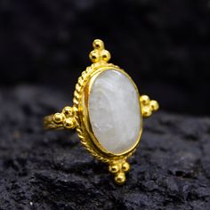 Ancient Art Oval Moonstone Ring | 24K Gold Plated | Tree Bark  Silver  Ring | 925 Sterling Silver | Boho Ring | Vintage Gift  Our shop offer free ring sizing Handcrafted Tree Bark Ring  Metal : 925 Sterling Silver Plating : 24K Gold Band Width : 4 mm Gem Stone :Moon Stone Gem Color : White Gem Size : 18 X 14 mm Ring Size : 30X 25 mm Ring Weight : 9.3 grams Ring Size : US 6 (The size you want is made for free). (We used the US standard sizing)  **Custom Orders is Made** As pellada family, we will be happy to help you if you contact us with the photo and dimensions of the design you want. To return back to Pellada Shop Home Page,Click here! https://www.etsy.com/shop/Pellada Thank you for shopping! Pellada Handmade Gold Celestial Moonstone Ring, Spiritual Gold Moonstone Cabochon Ring, Handmade Elegant Gold Moonstone Ring, Elegant Handmade Gold Moonstone Ring, Heirloom Style Handmade Gold Moonstone Ring, Handmade Heirloom Gold Moonstone Ring, Heirloom Handmade Gold Moonstone Ring, Handmade Artisan Oval Moonstone Ring, Handcrafted Oval Moonstone Ring