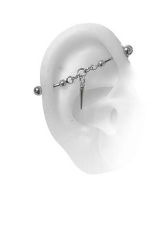 an ear with a chain attached to it and a piercing on the end of it