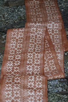 A vintage piece produced with traditional hand batik and hand dyed method using natural brown dye by Hmong tribe in Laos. The fabric is hemp and feature squares of beautiful traditional geometric pattern which symbolize animals and universe  Condition in very good Still remaining a little lovely smoked smell which comes with a lot of these old fabric from where they are stored or kept close to an open fire Measurement for 1 meter Width: 35 cm  Length:1 m ( whole roll 5.15m)  Weight:  70g ( whole Brown Dupatta With Traditional Patterns For Festivals, Traditional Brown Dupatta With Weaving Work, Bohemian Brown Handloom Dupatta, Traditional Brown Handloom Dupatta, Traditional Handloom Brown Dupatta, Traditional Brown Dupatta With Woven Motifs, Brown Tussar Silk Dupatta With Traditional Patterns, Natural Brown, Laos