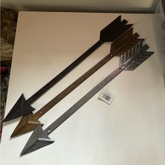 an assortment of different types of arrows on display