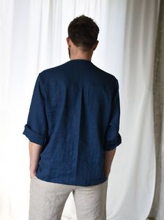 Casual Navy Linen Top, Blue Linen Shirt With Pockets, Casual Flax Long Sleeve Shirt, Blue Linen Shirt With Button Cuffs, Blue Linen Shirt With Relaxed Fit, Blue Linen Tops For Fall, Blue Linen Top With Buttons, Linen Shirt With Roll-up Long Sleeves, Long Sleeve Linen Shirt With Roll-up Sleeves