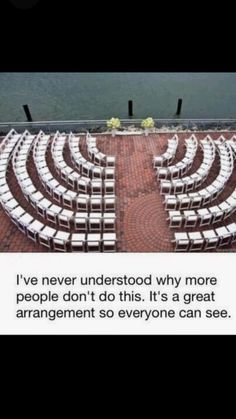 there are rows of white chairs in the middle of an empty area with words written on it