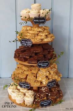 a tall tower with lots of different types of pastries on it's sides