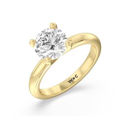 a yellow gold engagement ring with a round diamond in the center and two clawed shoulders