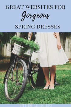 a couple standing next to each other near a bike with plants in the basket on it