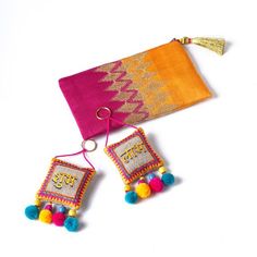 DIWALI GIFT PACKEmbroidered Silk Party clutchPair of Handmade SHUBH-LABH tassels'Gift wrapping' available to send these gifts to your loved ones.Pick a combo pack from VLiving's range of Diwali gifts to someone you love.We have taken away the stress of choosing and figuring out a gift and made it easy for you to simply pick a set and give a gift that is unique, handmade & stylish.CLUTCH -  Embroidered silk party clutch/purseSHUBH LABH tassels - great gift accompaniment for any Indian Festiva Festive Gold Bag With Tassels, Festive Celebration Bags With Tassels, Rectangular Tasseled Clutch As Gift, Festival Bags With Tassels As Gifts, Diwali Gift Packs, Silk Clutch, India Gift, Diwali Rangoli, Bag Designs