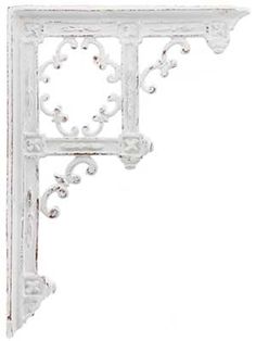 an ornate white shelf bracket with beading