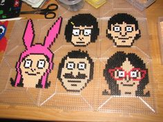 the pixel art is made to look like people with glasses and bunny ears on their heads