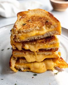 three grilled cheese sandwiches stacked on top of each other