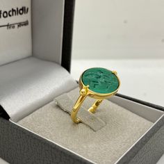 14k yellow gold special signet ring with a beautiful natural malachite engraved with a winged angel in love.  Malachite is known as the stone of transformation, it inspires you to push yourself beyond your comfort zone and gives you the strength to do so.  Dimensions of the green gemstone: 13.0 * 17.0 mm. / 0.51 * 0.67 inch.  Ring size : 53.0 FR. This ring can be made in our workshop at any size. 14k yellow gold chevalier and not only ring with carved natural vivid green gemstone showing a love Winged Angel, Turquoise Gold Ring, An Arrow, Baby Angel, Green Gemstones, Natural Turquoise, Signet Ring, Statement Ring, Favorite Jewelry