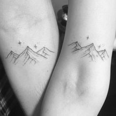 two people with matching tattoos on their arms