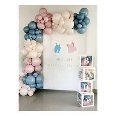 a baby shower backdrop with balloons on the wall