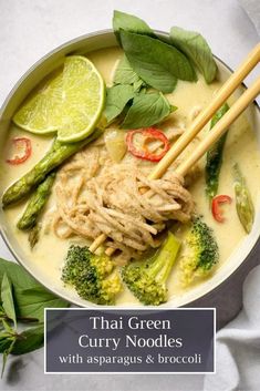 thai green curry noodles with asparagus and broccoli in a white bowl