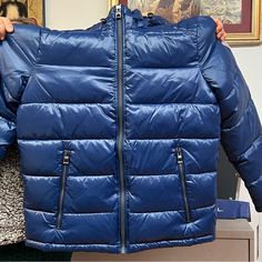 Warm And Lightweight Puffer Jacket From Guess Brand Medium Blue Jacket New With Tag On Casual Down Parka With Zipper Closure, Casual Down Parka With Zipper, Blue Puffer Jacket With Detachable Hood For Outdoor Activities, Blue Long Sleeve Outerwear With Zipper Closure, Blue Long Sleeve Outerwear With Zipper, Blue Puffer Jacket With Adjustable Hood For Outdoor, Blue Puffer Jacket With Adjustable Hood For Outdoor Activities, Winter Outerwear With Zipper Closure In Blue, Blue Nylon Parka For Outdoor Activities