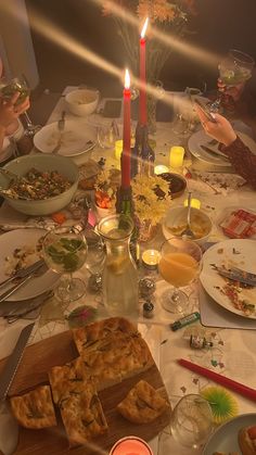 a group of people sitting around a dinner table