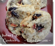 three cookies with nuts and raisins are on a red plate, ready to be eaten