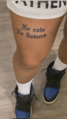 the legs and ankles of a person with tattoos that say no rain, no flowers