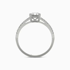 a white gold engagement ring with diamonds on the side