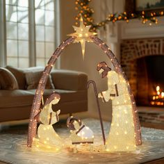 lighted nativity scene in living room with fireplace