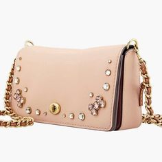 Coach Dusty Pink Leather Crystal Embellished Dinky Crossbody Bag Coach Ladies Dinky Crystal Crossbody Bag. A Coach Crossbody Featuring Crystal Embellishments, Removable Chain Strap And One Main Internal Compartment. Removable Chain & Leather Crossbody Strap With 22" Drop Approximate Measurements: 9"X5"X2" Condition: New Without Tags Note: Missing Coach Brand Leather Tag Small Scuff On Interior Leather Near Buckle, As Pictured Always Open To Offers Bundle To Save Reach Out If You Have Any Q’s Fol Crossbody Bag Coach, Camera Bag Purse, Saddle Bag Purse, Coach Crossbody Purse, Leather Tag, Leather Duffle, Pink Bling, Coach Crossbody, Coach Crossbody Bag