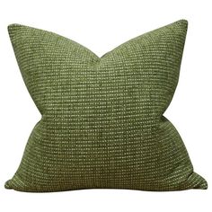 a green pillow on a white background