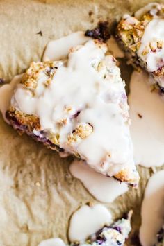 some food is sitting on top of a table with white icing and sprinkles