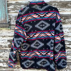 Aztec Fleece Jacket for Women – Western Zip-Up Sweatshirt, Black Aztec Boho My go-to fleece sweatshirt this Fall! This stylish Western Aztec Fleece Jacket features a vibrant Aztec print in black, grey, hot pink, orange, and turquoise for a boho-chic flair. With a convenient zip-up design, this jacket is perfect for Fall weather—warm, cozy, and lightweight! ✅ Eye-Catching Design: Bold Aztec print adds a fun and fashionable touch.✅ Convenient Zip-Up: Easy to wear and take off, perfect for on-the-g Multicolor Long Sleeve Top For Outdoor, Multicolor Fleece Sweatshirt With Long Sleeves, Multicolor Fleece Long Sleeve Sweatshirt, Multicolor Long Sleeve Fleece Sweatshirt, Fleece Long Sleeve Top For Outdoor, Long Sleeve Fleece Top For Outdoor, Multicolor Winter Tops For Outdoor, Multicolor Fleece Outdoor Outerwear, Multicolor Fleece Outerwear For Outdoor