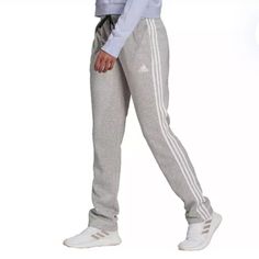 Small Adidas Multi Sport Sweatpants White Sportswear Pants With Three Stripes Branding, White Pants With Three Stripes, White Lounge Pants With Three Stripes, White Three Stripes Pants For Loungewear, White Three-stripe Pants For Loungewear, Adidas White Trousers, Adidas White Three Stripes Sweatpants, White Adidas Sportswear Joggers, Adidas White Sportswear Joggers