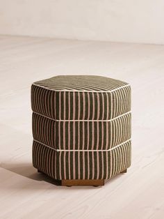 three striped stools stacked on top of each other