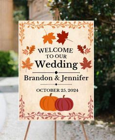 a welcome sign with fall leaves on it