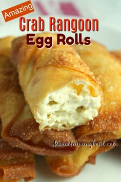 crab rangoon egg rolls on a plate with text overlay reading amazing crab rangoon egg rolls