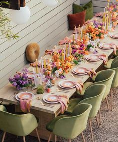 a long table set with plates and place settings