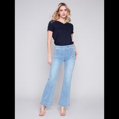 Shake Things Up In These Flared Twill Jeans For Women. The Stretchy Jeans Come With Decorative Button Plackets At The Waistband In The Front, A Regular-Rise Waist, And A Flattering Flared Leg To Let You Enjoy Spring And Summer In Style And Comfort. Get Them In Two Shades. Look No Further Than These Light Blue Jeans For Women. Mid-Rise Waist Decorative Buttons At Front Waistband Stretch Denim Flare Leg Design Pull-On Style 2 Back Pockets Blue Denim Flare Jeans With Buttons, Summer Denim Blue Flare Jeans With Button Closure, Trendy Spring Flare Jeans With Buttons, Denim Blue Flare Jeans With Buttons, Trendy Denim Flare Jeans With Buttons, Summer Mid-rise Flare Jeans With Button Closure, Mid-rise Flare Jeans With Button Closure For Summer, Blue Flare Jeans With Button Closure For Spring, Spring Medium Wash Flare Jeans With Button Closure