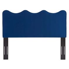 an upholstered headboard with wooden legs and a blue fabric cover on it