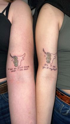 two women with tattoos on their arms that say, i love you to the moon and back