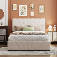 a white bed sitting in a bedroom on top of a hard wood floor