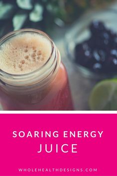 a mason jar filled with liquid next to some fruit and vegetables on a table, text reads soarring energy juice