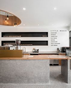 an empty counter in a restaurant with lots of windows