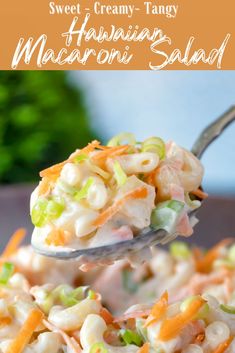 a spoon full of macaroni salad with carrots and celery on it